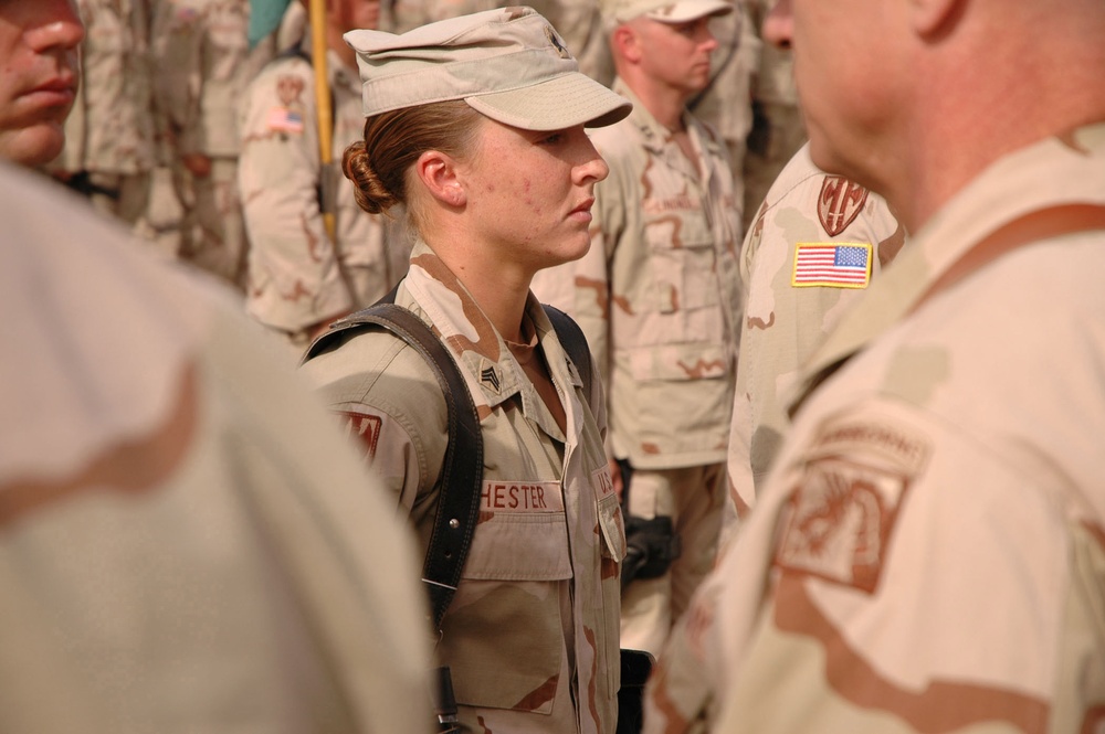 U.S. Army Sgt. Leigh Ann Hester stands at attention before receiving the Silver Star.