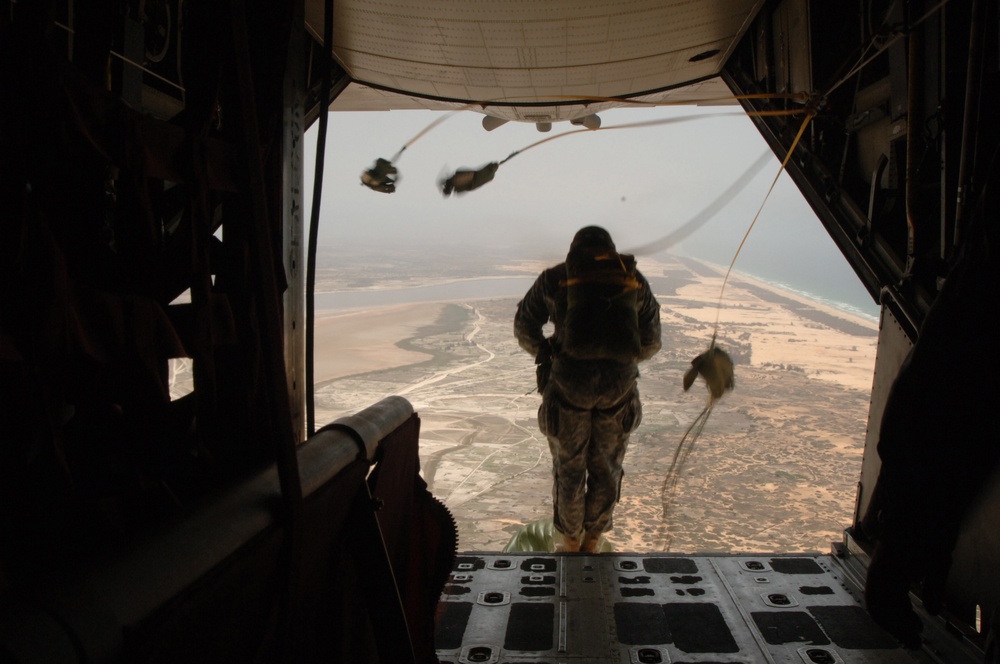 Senegal Army soldiers and U.S. Army Special Operations Command-Europe soldiers perform a static-line parachute jump.