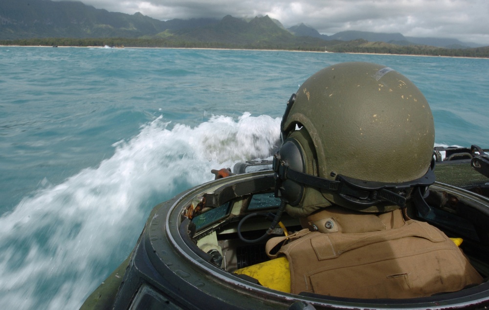 U.S. Marine Corps Lance Cpl. Douglas Young drives an amphibious assault vehicle.