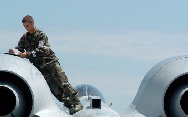 Airman 1st Class Chad Ferguson works on an engine nacelle of an A-10 Thunderbolt II.