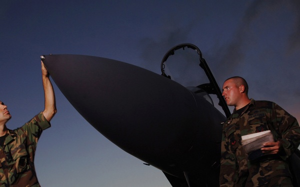 F-15 Eagle Crew Chiefs Staff Sgts. Andrew Johnson and Brian Goodman inspect their aircraft.
