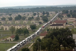 Hundreds of buses disgorge thousands of Hurricane Katrina evacuees at Fort Chaffee Arkansas National Guard post.