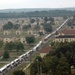 Hundreds of buses disgorge thousands of Hurricane Katrina evacuees at Fort Chaffee Arkansas National Guard post.