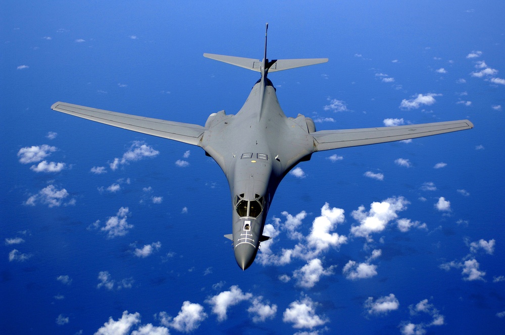 A B-1B Lancer soars over the Pacific Ocean as it maneuvers in for aerial refueling. A B-1B Lancer soars over the Pacific Ocean as it maneuvers in for aerial refueling.