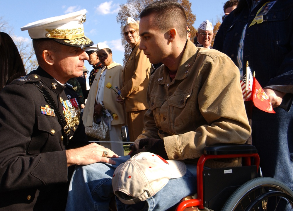 Gen. Peter Pace talks with a Marine wounded in Operation Iraqi Freedom.