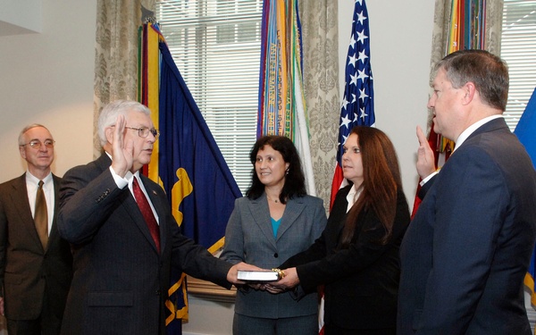 John G. Grimes takes the oath of office.