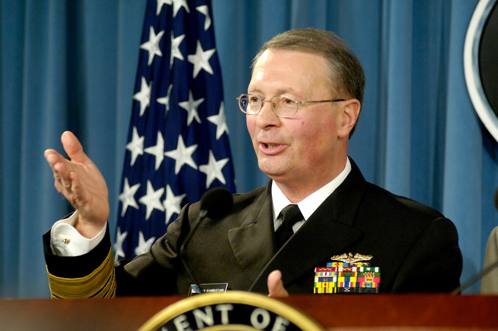 Adm. Edmund P. Giambastiani answers a reporter's question during a press briefing.