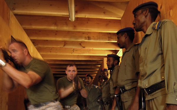 Cpl. Steven Jacobs and Sgt. Earnest Robke show the Djiboutian Police how to move in teams of two.