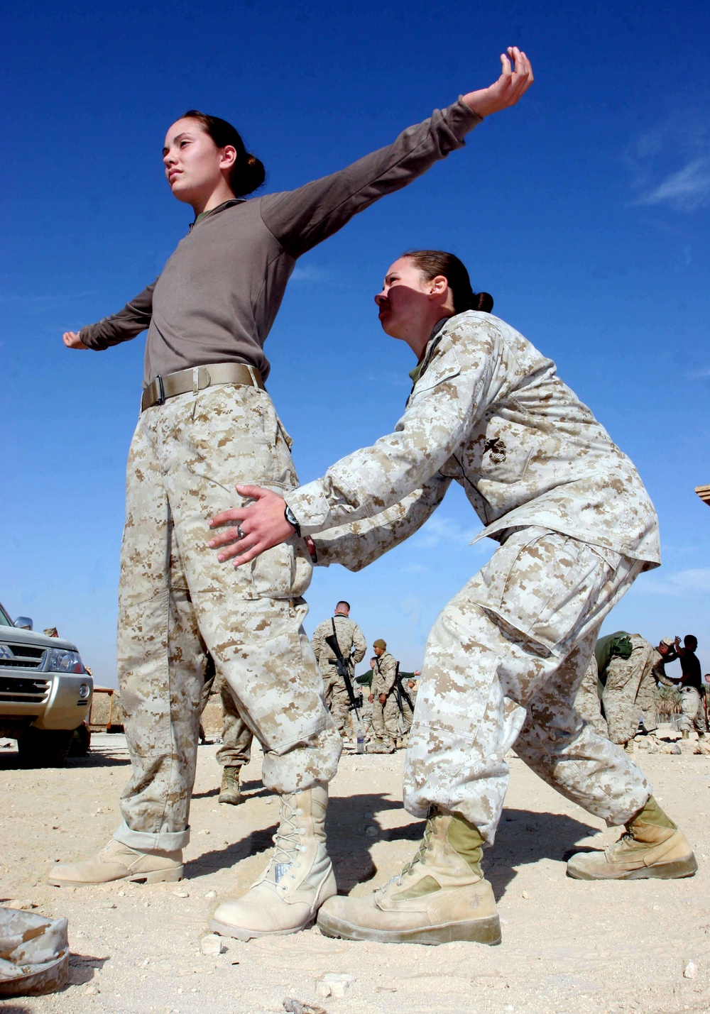 U.S. Marines practice personnel search procedures.