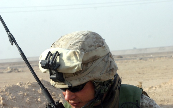 Marine Sgt. Brandon Shofne radios into headquarters.