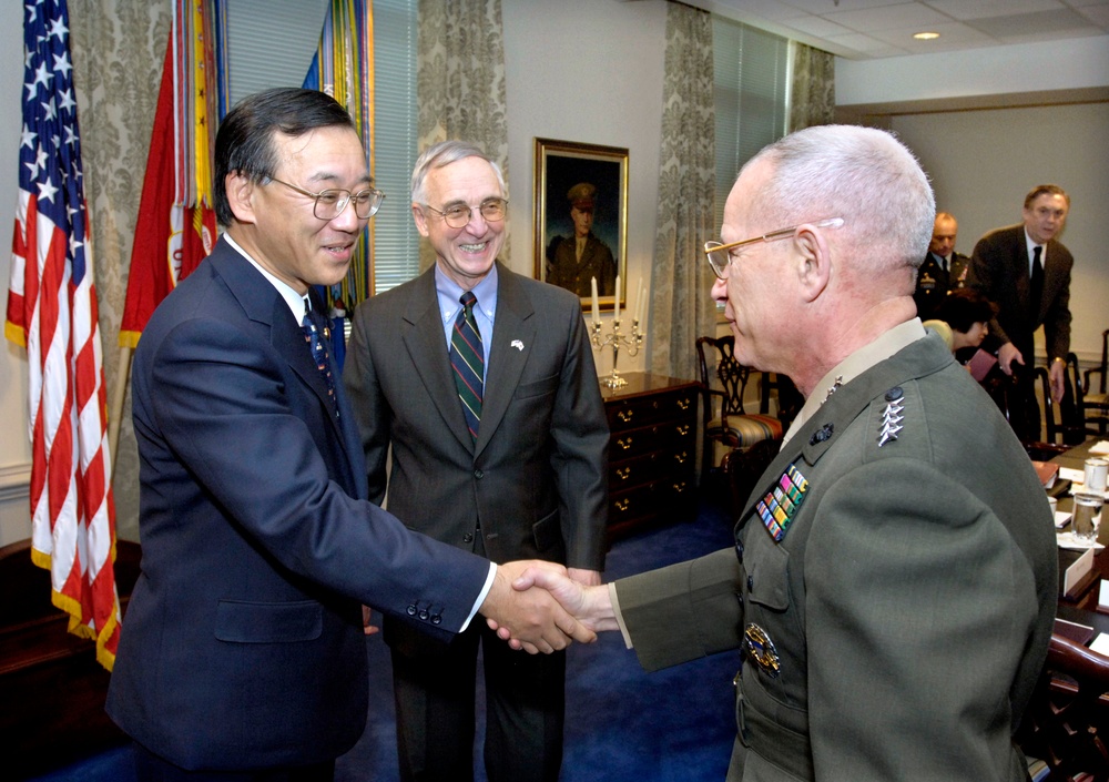 Deputy Secretary England introduces Assistant Commandant Gen. Robert Magnus to Japanese Minister of Finance Sadakazu Tanigaki.
