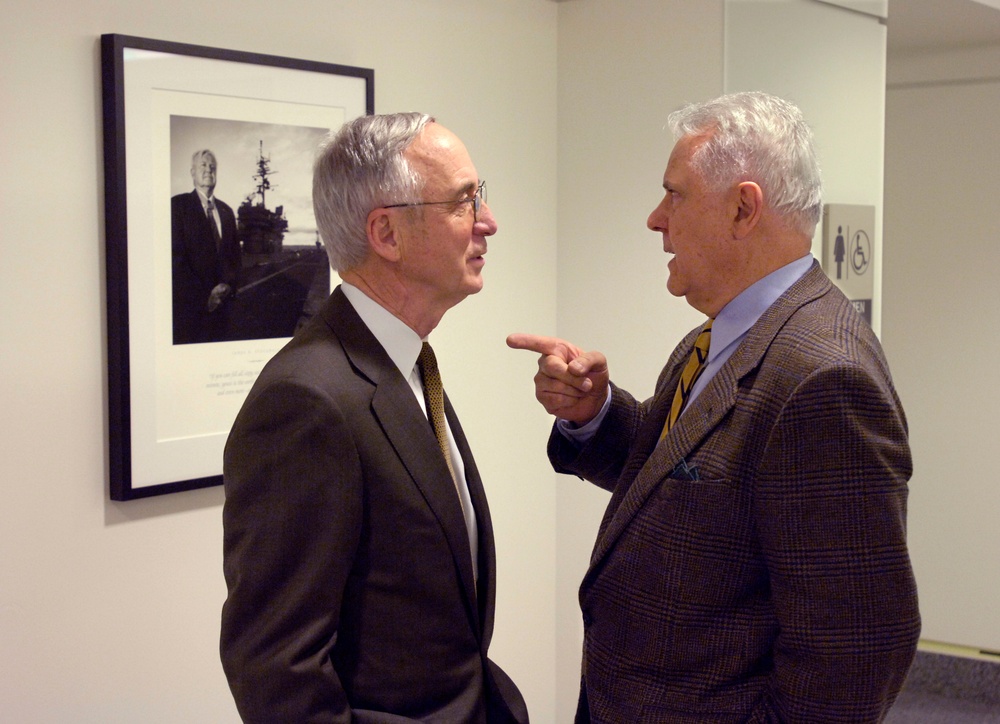 Photographer Nick DelCalzo talks to Deputy Secretary of Defense Gordon England.