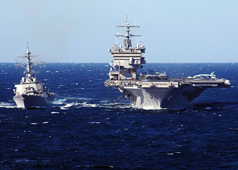 The aircraft carrier USS Enterprise (CVN 65) conducts a refueling at sea.