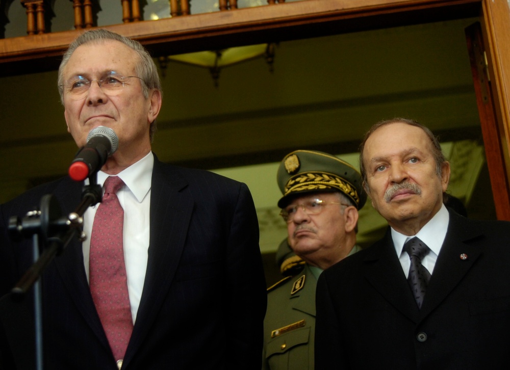 Secretary Rumsfeld and Algerian President Abdelaziz Bouteflika listen to a reporter's question.