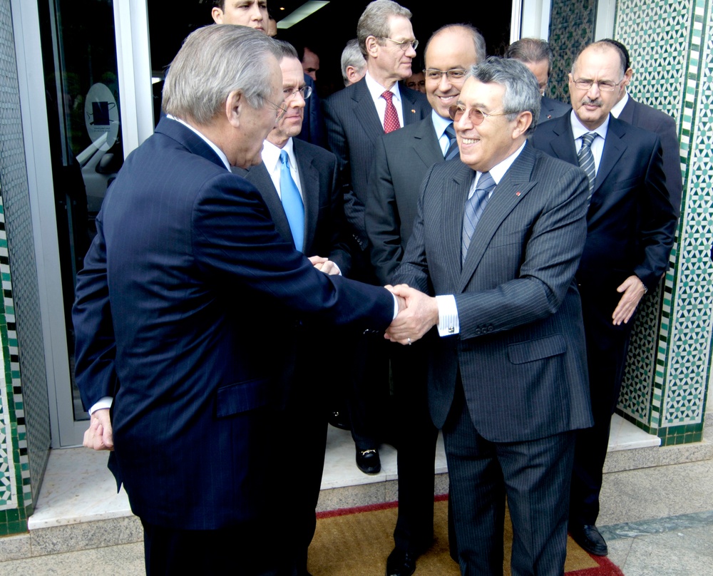 Moroccan Minister of Foreign Affairs Mohamed Benaissa shakes hands with Secretary Rumsfeld.