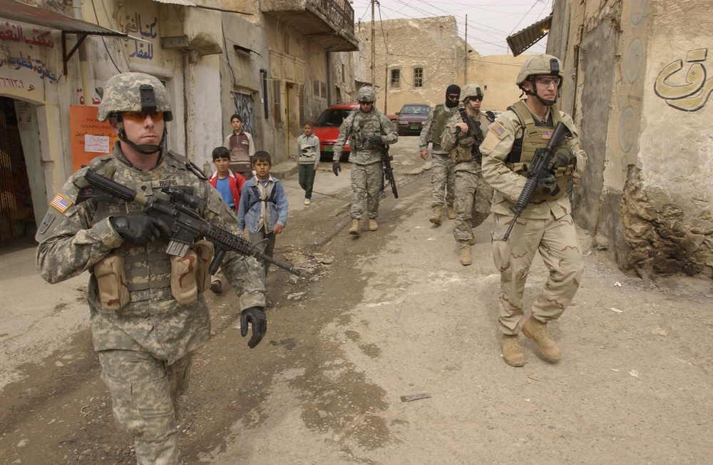 Soldiers patrol the streets of Tall Kayf, Iraq. Soldiers patrol the streets of Tall Kayf, Iraq.