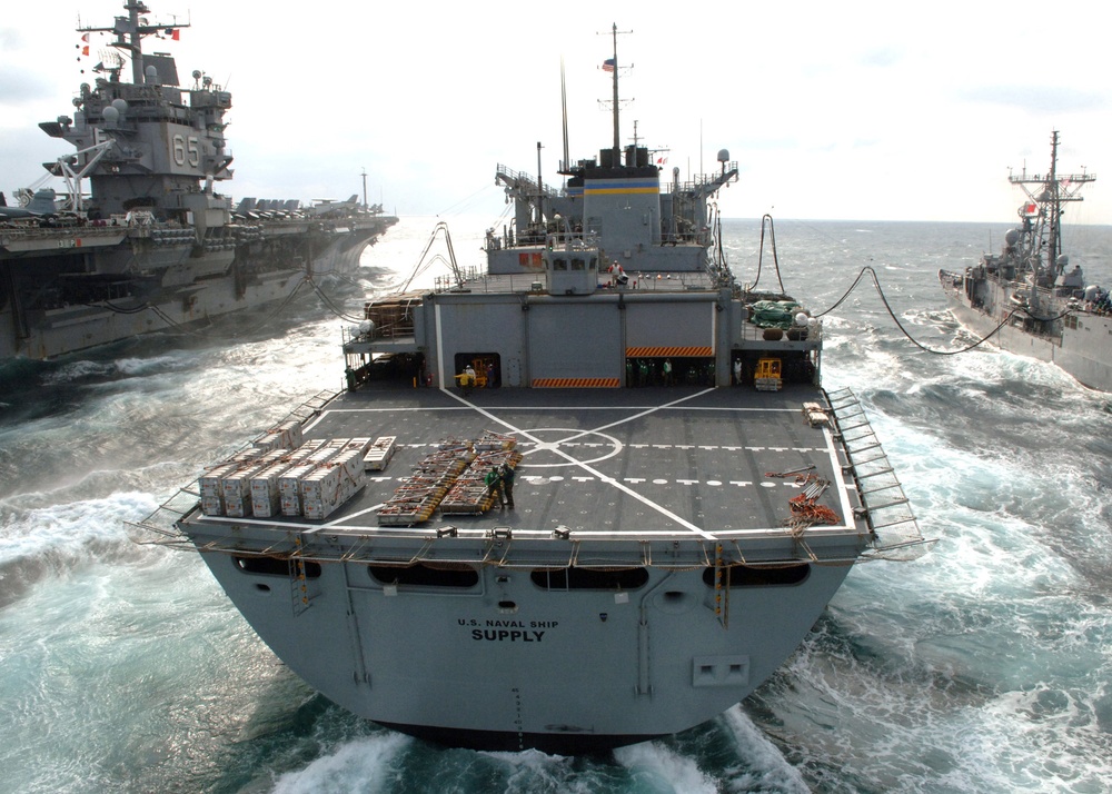 The USNS Supply pumps fuel to the USS Taylor and the USS Enterprise.
