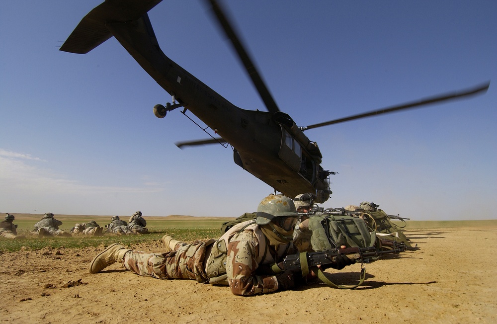 Iraqi army and U.S. Army soldiers secure a landing zone.