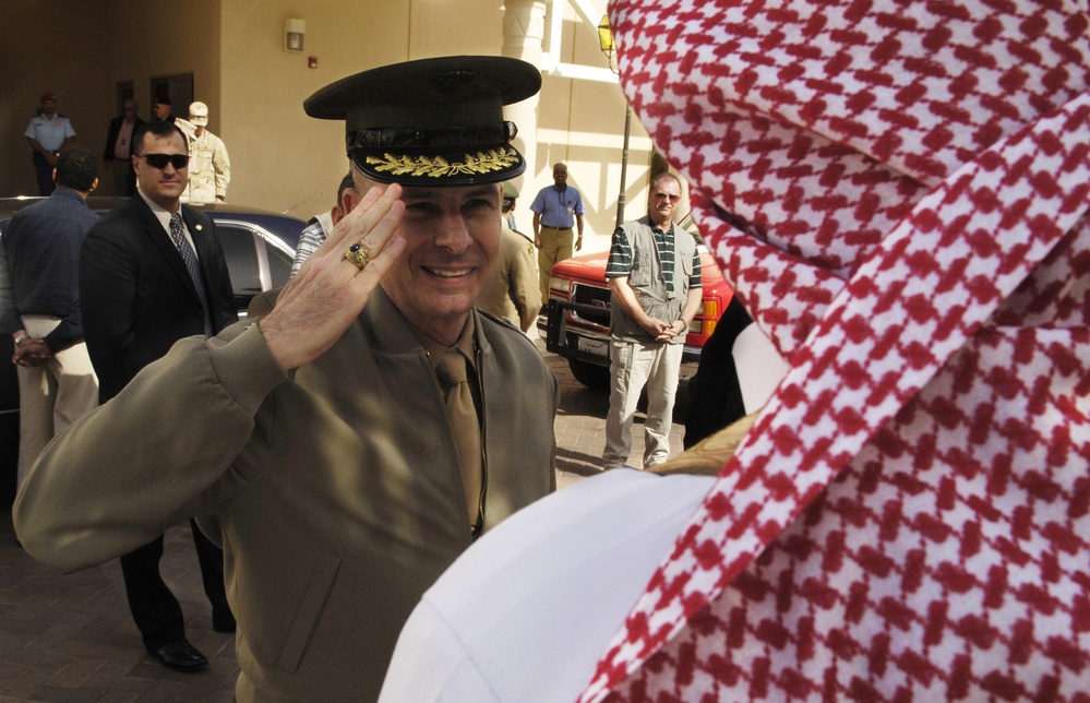 Gen. Peter Pace, U.S. Marine Corps, returns the salute of a Saudi Arabian soldier.
