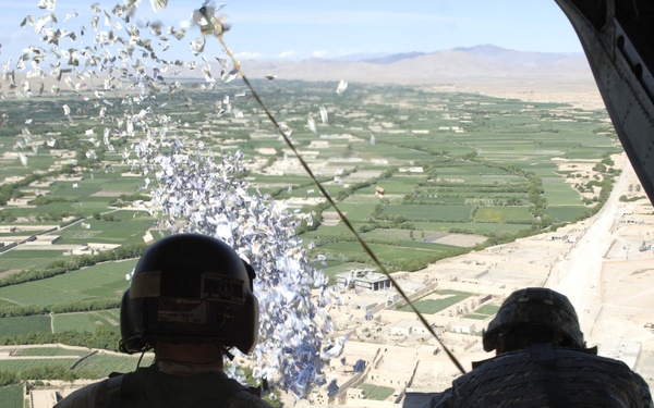 Sgt. 1st Class Len Tidey and Sgt. 1st Class Tom Rees execute a leaflet drop.