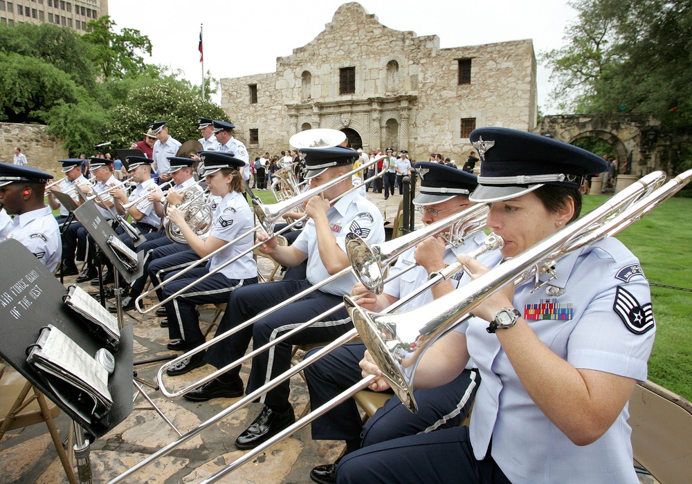 The Air Force Band of the West performs in front of the Alamo.
