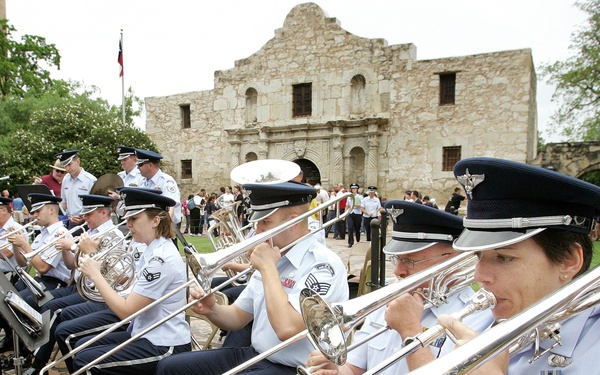 The Air Force Band of the West performs in front of the Alamo.