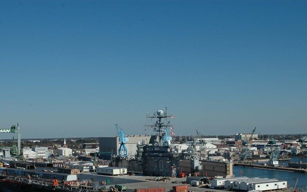 The USS Carl Vinson (CVN 70) is towed from pier 14 at Naval Station Norfolk.