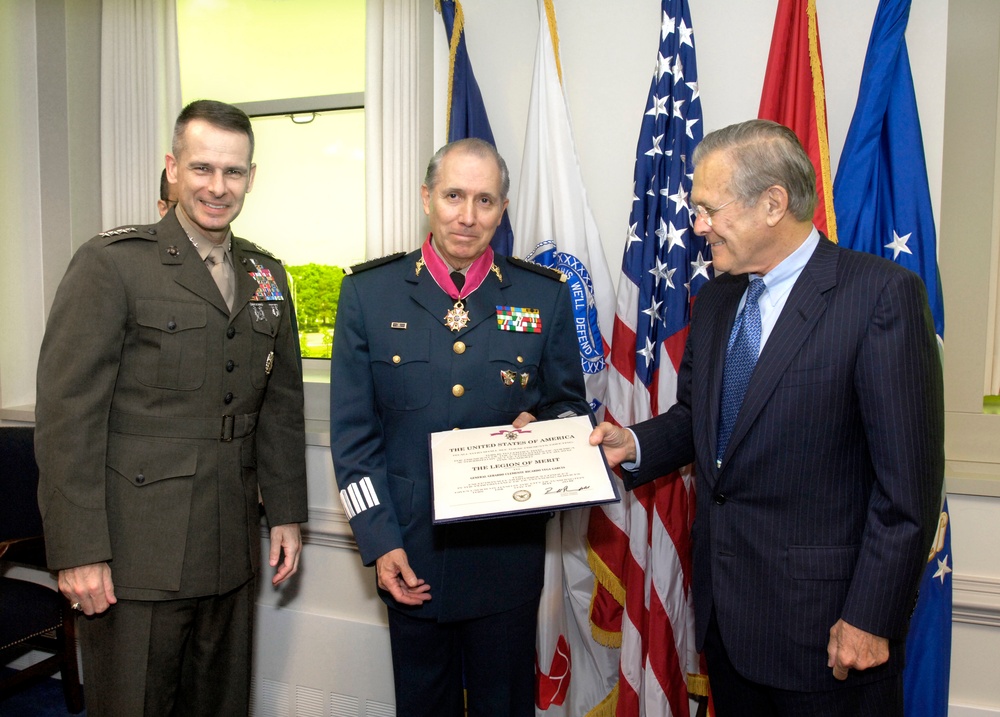 Secretary Rumsfeld presents the Legion of Merit medal to Mexican Minister of Defense Gen. Gerardo Ricardo Vega.