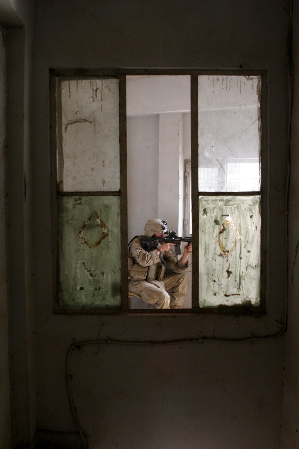 Lance Cpl. Rick Z. James scans the street while providing security.