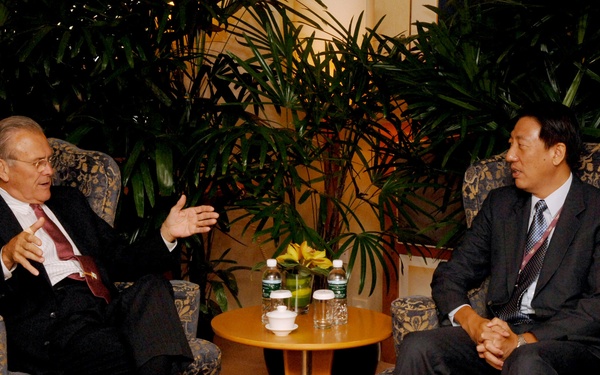 Secretary Rumsfeld talks with Singapore's Minister of Defense Teo Chee Hean.