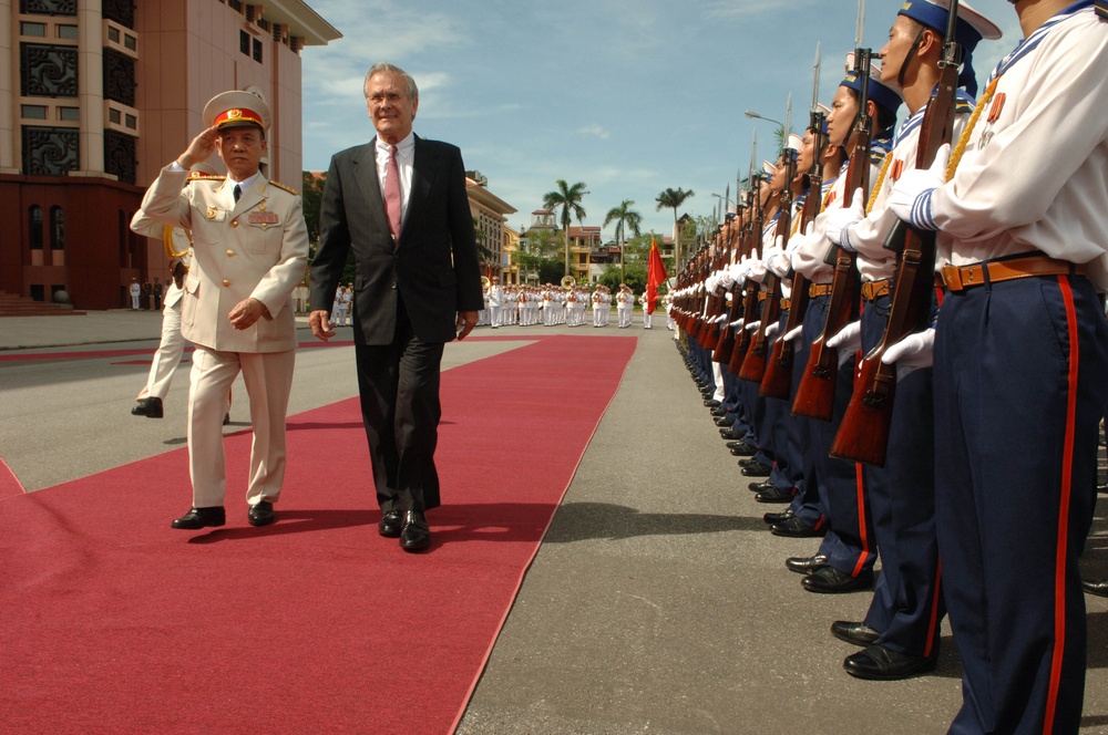 Vietnamese Minister of Defense Gen. Pham Van Tra escorts Secretary Rumsfeld.