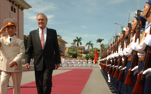 Vietnamese Minister of Defense Gen. Pham Van Tra escorts Secretary Rumsfeld.