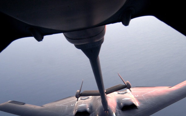 A U.S. Air Force B-2 Spirit bomber conducts an in-flight refueling.