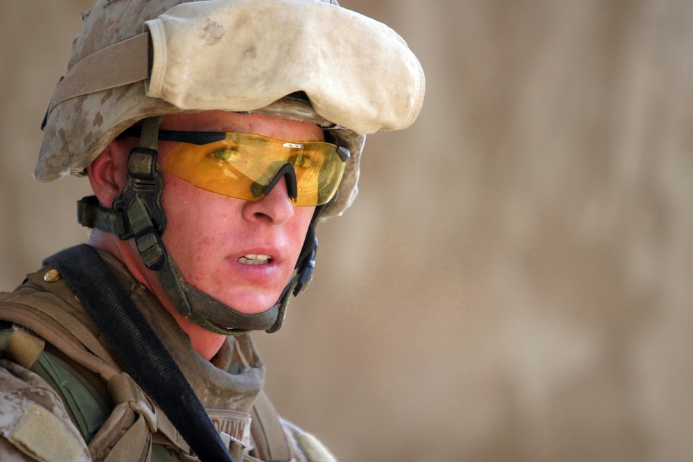 U.S. Marine Corps Sgt. Mike B. Dunn patrols through Haditha, Iraq.