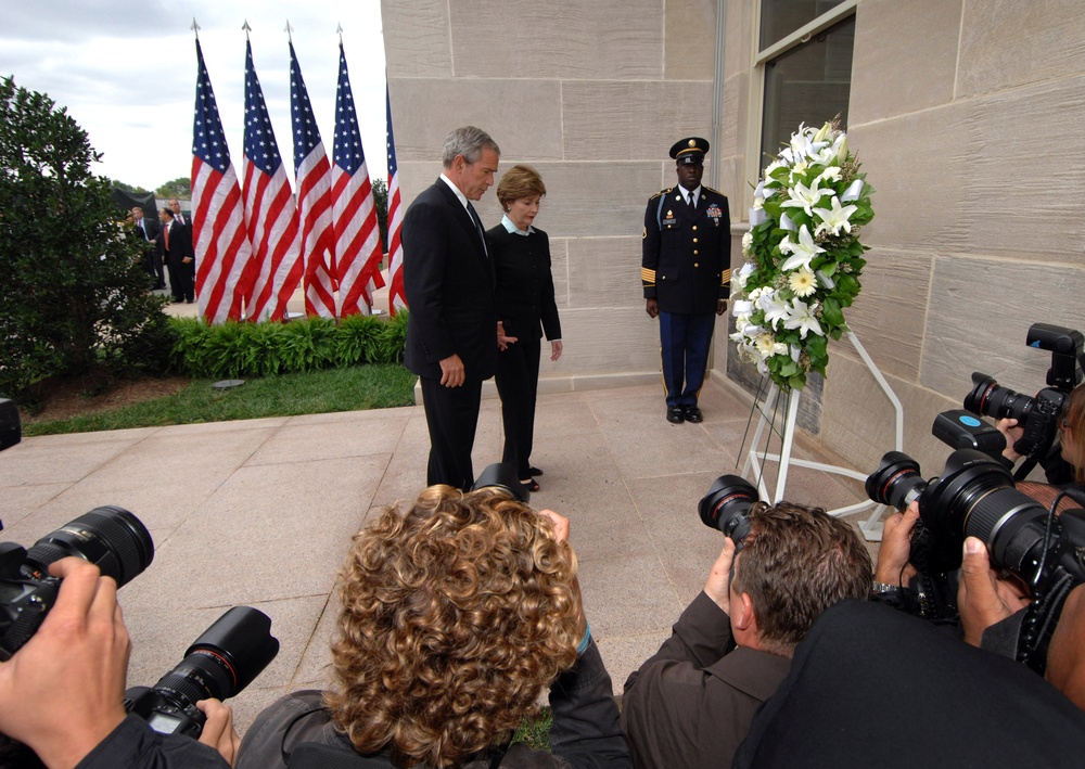 President Bush and First Lady Laura Bush pause for a moment of reflection.