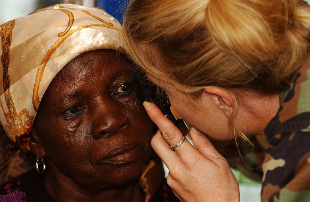 Capt. Christy Barton performs a cataract test on a Ghanaian woman.