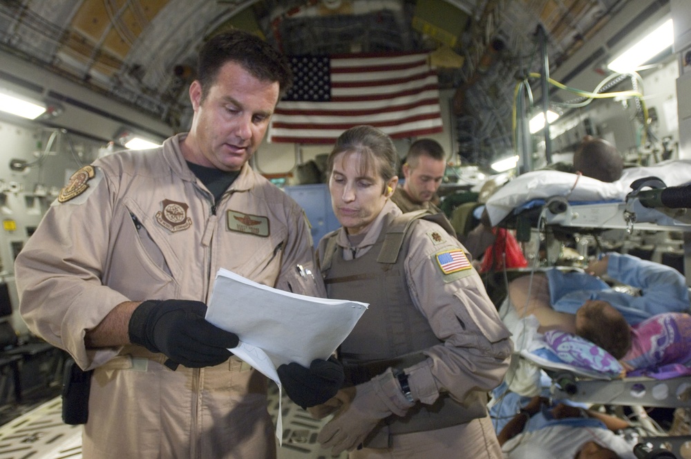 Tech. Sgt. Scott Drake and Maj. Jacqueline Deeds check the paperwork.