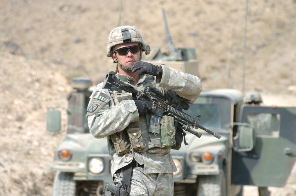 U.S. Army Staff Sgt. Norman Bone directs movement.