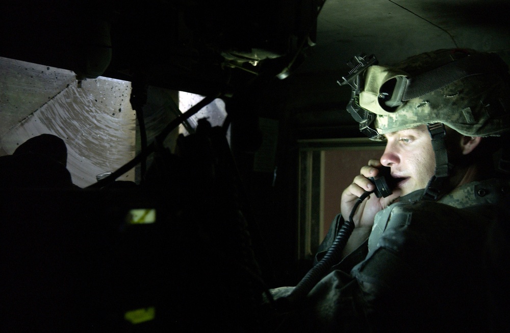 Staff Sgt. Shawn Smith watches his Blue Force Tracker.