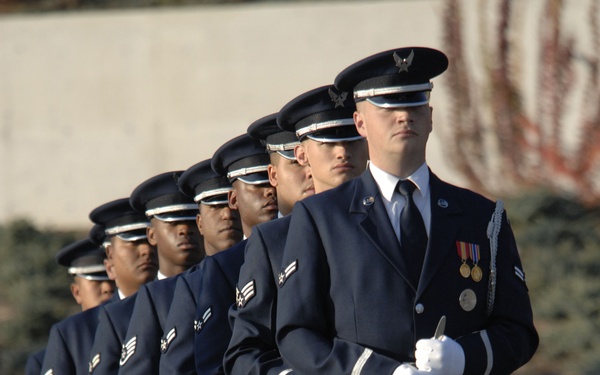 U.S. Air Force honor guardsmen stand in formation.