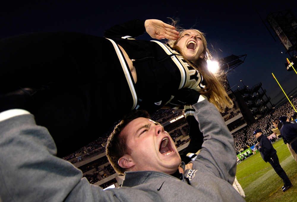 U.S. Army Military Academy cheerleaders cheer.