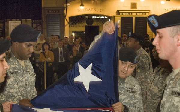 U.S. Army soldiers fold a 20' X 30' flag in Grand Central Terminal in New York City.