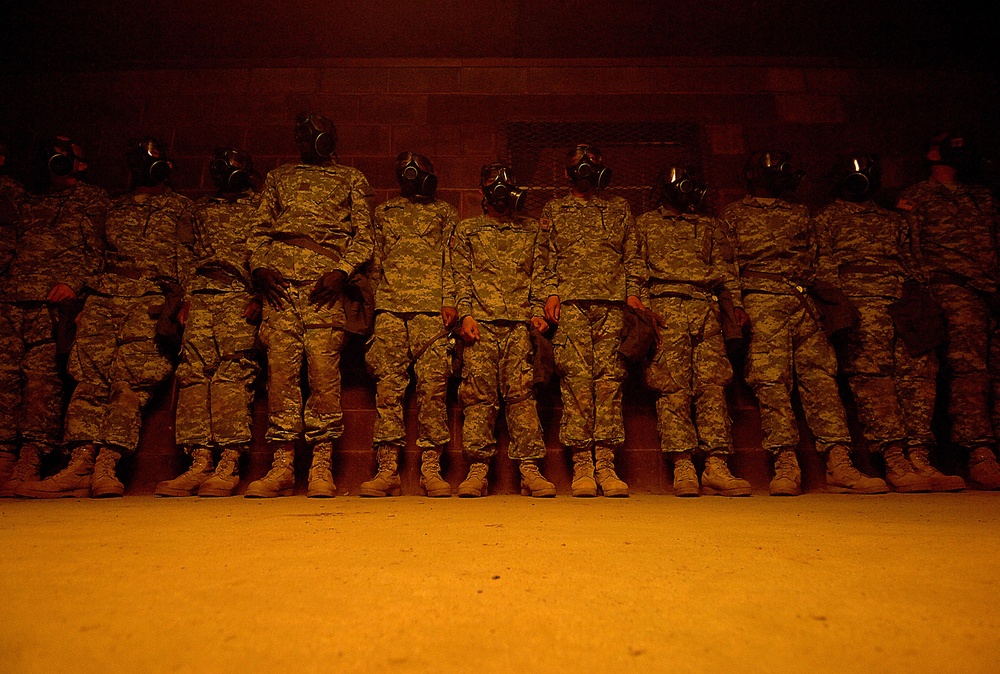 Soldiers going through U.S. Army basic training line the wall.