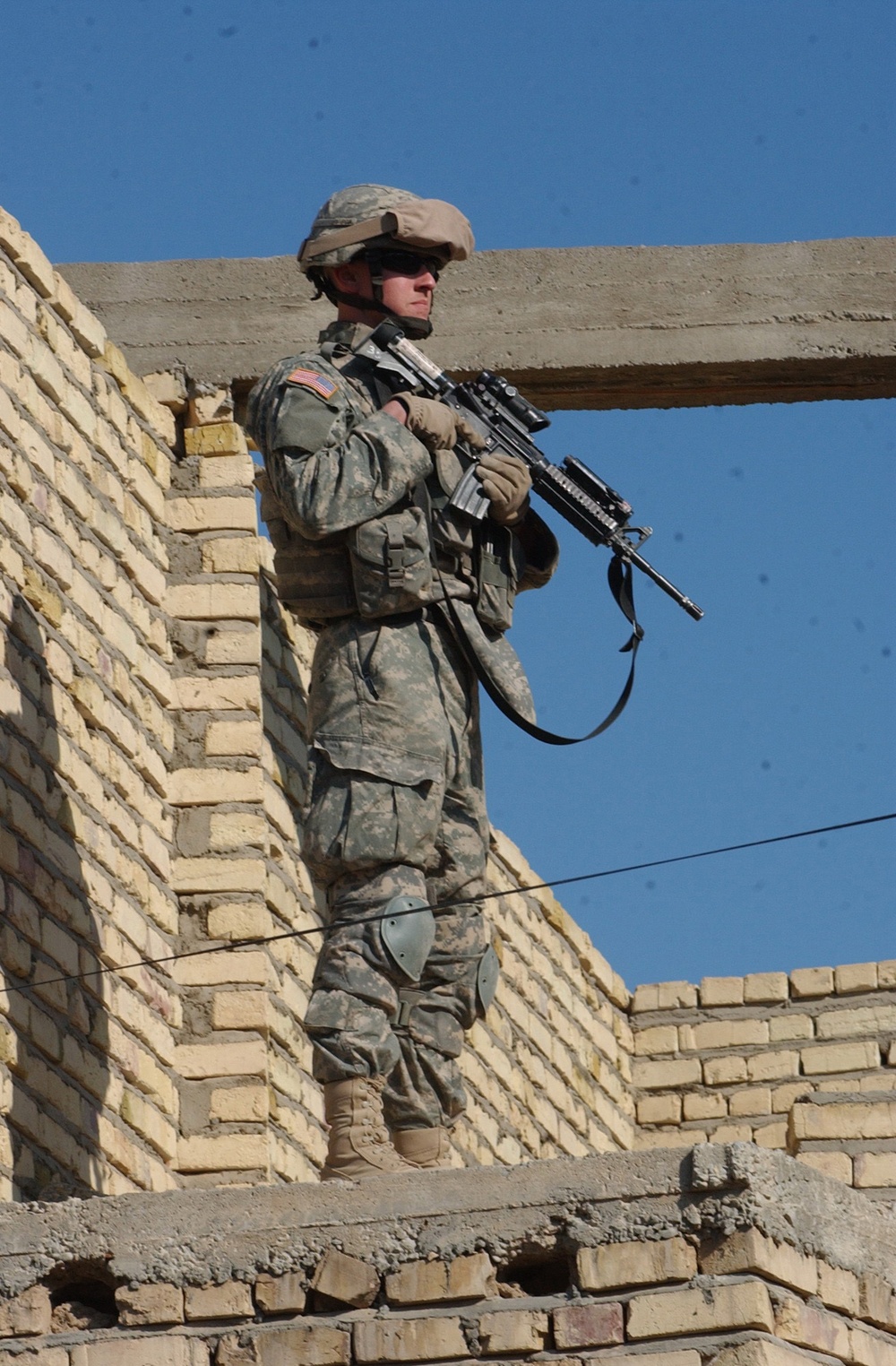 Pfc. Chris Anderson keeps an eye on the street.