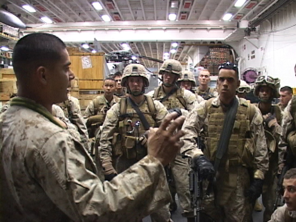 U.S. Marine Corps 2nd Lt. Juan Cristales debriefs his platoon.