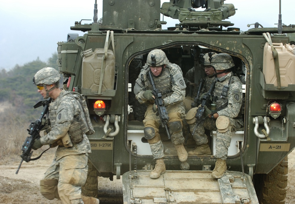 U.S. Army soldiers exit their M1126 Stryker Infantry Carrier Vehicle.