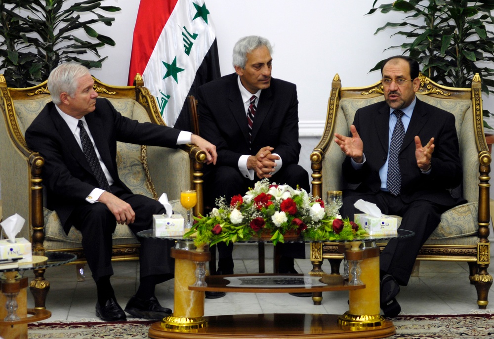 Secretary Gates listens as Iraqi Prime Minister Nouri al-Maliki speaks.