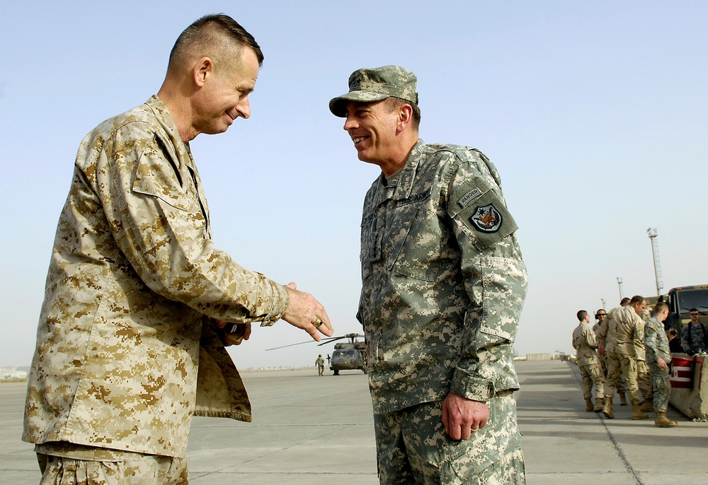 Gen. Peter Pace says goodbye to Army Gen. David Petraeus.