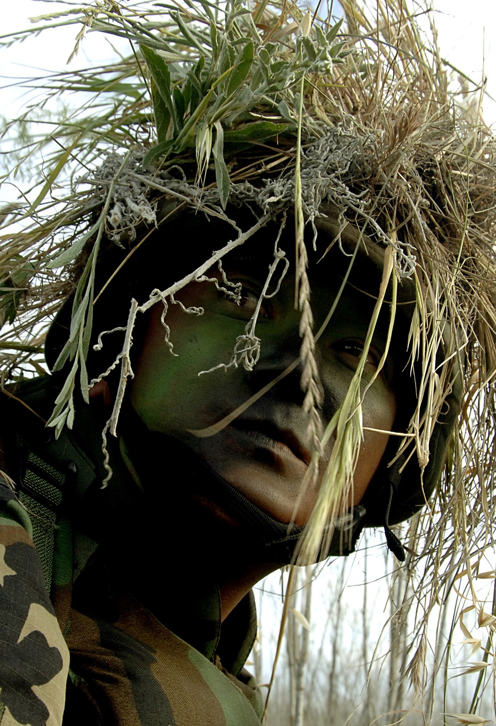 U.S. Air Force Airman 1st Class Johnathan Foster looks back at his squad-mates.