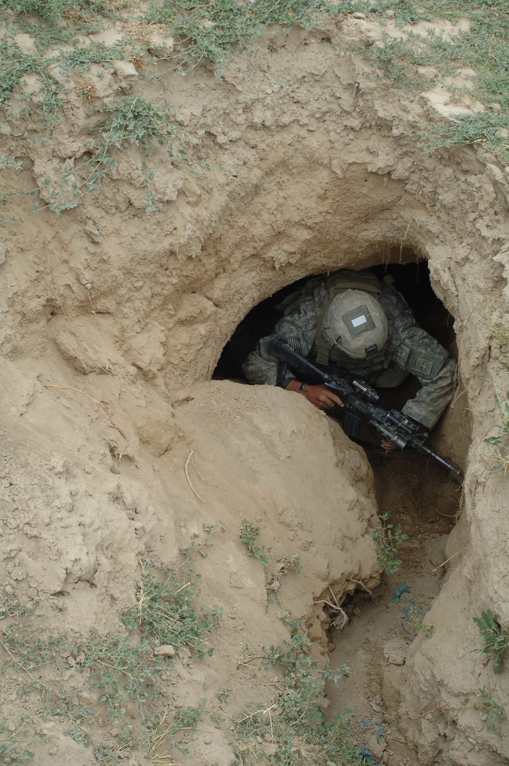 U.S. Army Spc. William Fowler enters a cave.